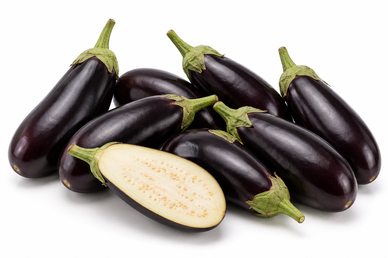 Fresh Egyptian aubergines with deep purple skin and a cut fruit
